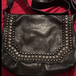 Real leather and studded messenger bag.